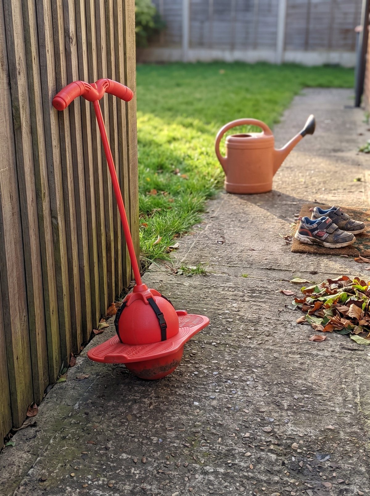 Balance jumping stick ready for use on a driveway