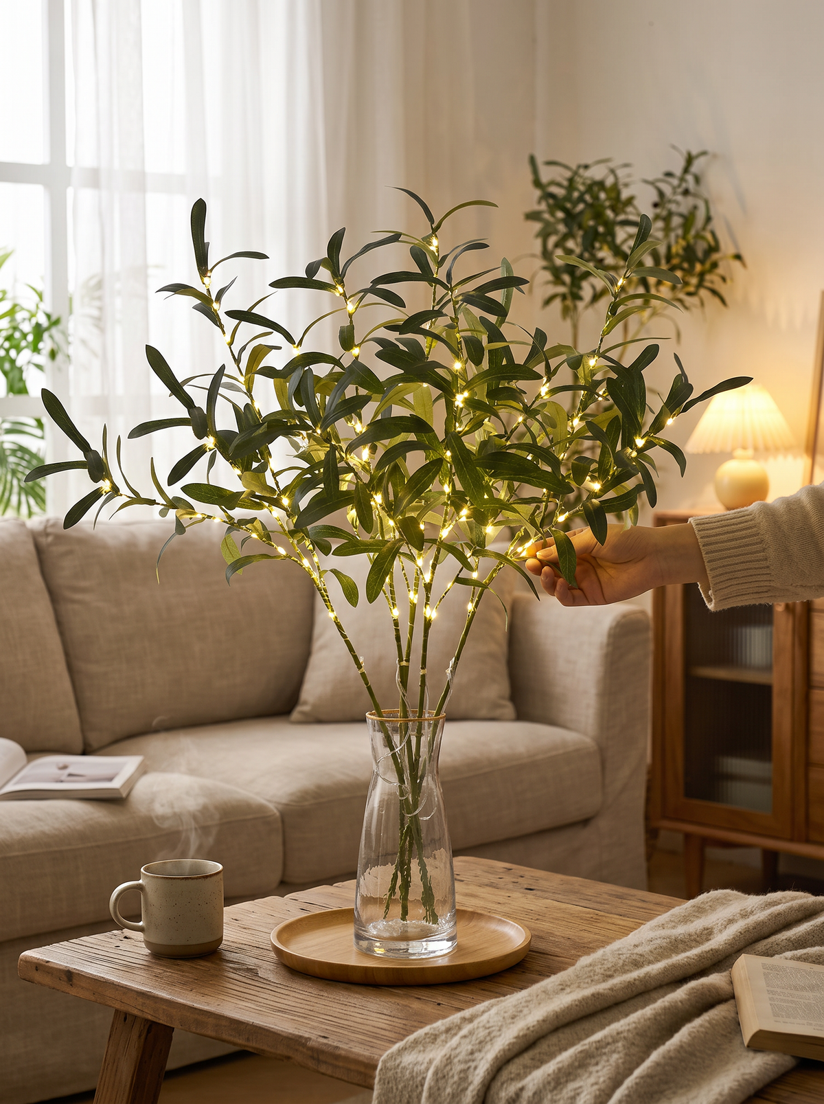 LED branch floral table light lit on a console