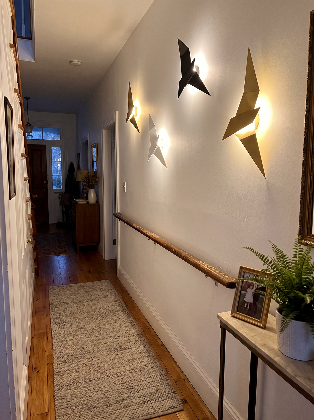 Origami sconce finish against a painted wall