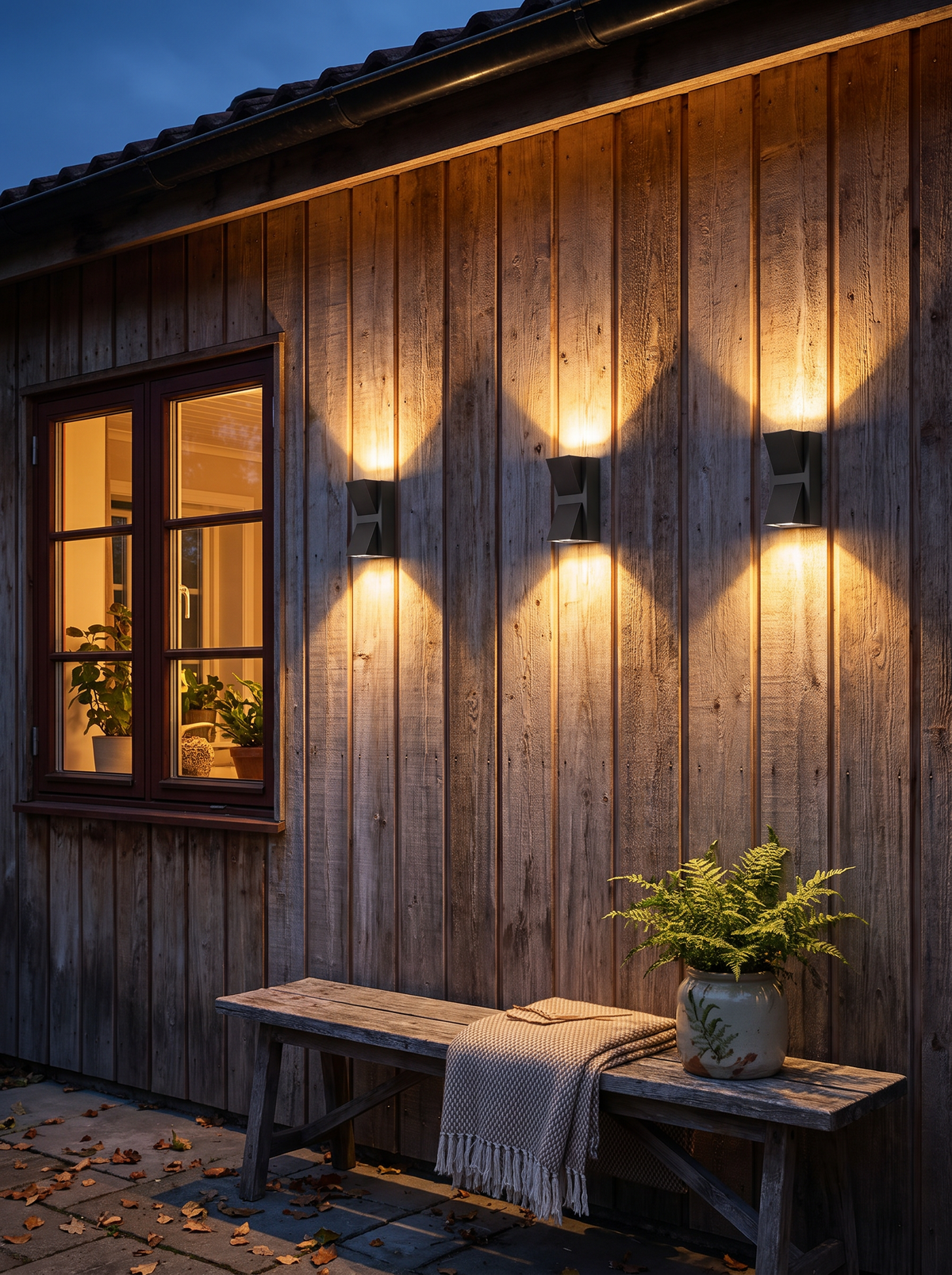 Waterproof outdoor wall light on a garden wall